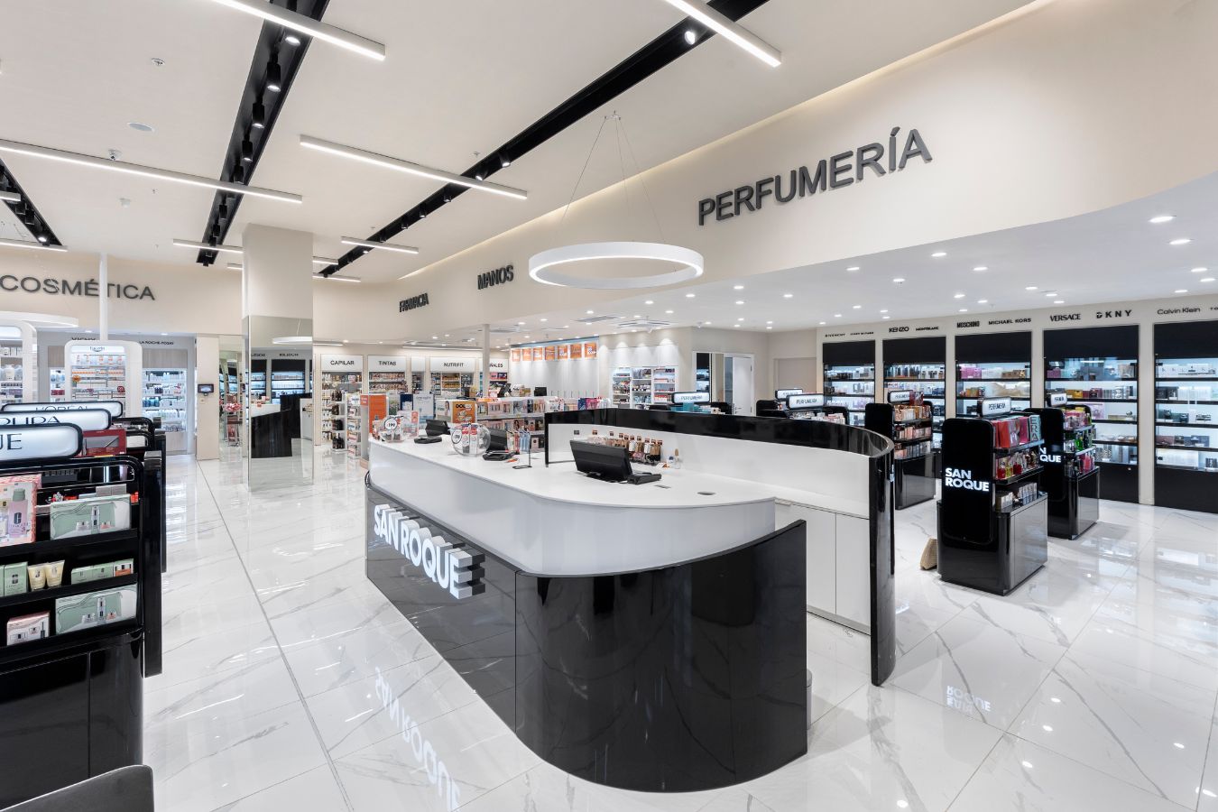 San Roque Pharmacy - Curved high-gloss black service counter and customer assistance area - Contract Workplaces.jpg